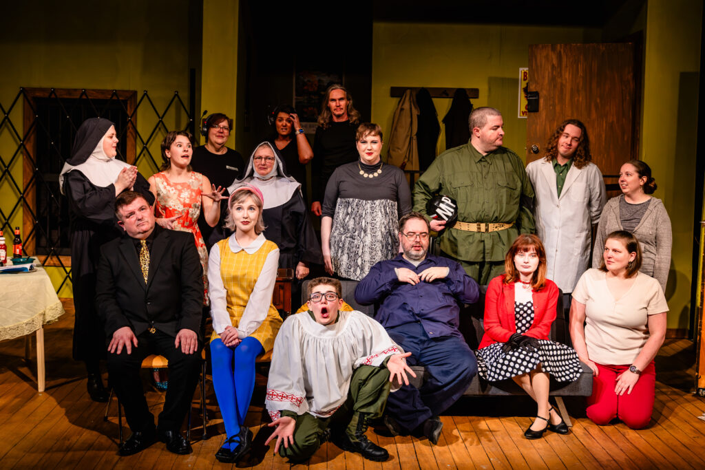 Cast of the House of Blue Leaves poses energetically